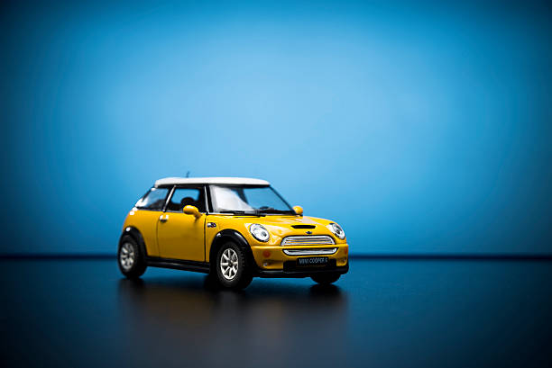 A yellow color Mini Cooper