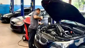 A reliable mechanic inspecting a German car in Hollywood, FL, emphasizing the search for a mechanic near me.